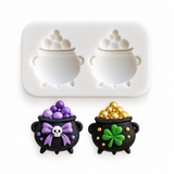Two-cavity bubbling cauldron silicone mold with Halloween and pot of gold decorated cauldron examples on a white background.