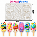 Colorful back-to-school cakesicles decorated with school bus, pencil, crayons, backpack, stacked books and globe