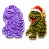 Royal Orchid Lavender Christmas T-Rex cookie cutter and embosser with matching decorated sugar cookie holding a decorated Christmas tree.