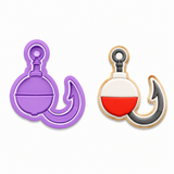 A purple plastic cookie cutter shaped like a fishing hook and bob weight, shown next to a decorated example of a cookie cut out on a white background.