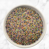 Midnight Magic Halloween sanding sugar blend featuring black, orange, purple, green, and white sugar crystals for decorating cookies, cupcakes, cakes, cake pops, and festive Halloween treats.