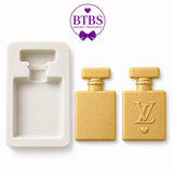 Perfume bottle silicone mold with two gold finished bottle examples decorated with white bows and flowers.