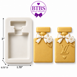 Perfume bottle silicone mold with gold finished examples and cavity measurements of approximately 3 inches by 1.70 inches by 0.75 inches.