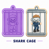 A product display showing a purple silicone mold with an embossed cartoon diver and a matching shaped cookie or tray with a cartoon diver character wearing a shark cage, on a white background with the text 'SHARK CAGE' underneath.