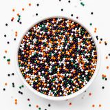 Spooky Nights Halloween Nonpareils Sprinkles featuring black, orange, purple, green, and white nonpareils for decorating cookies, cupcakes, cakes, cake pops, and festive Halloween desserts.