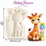 Safari baby shower cupcake decorated with an adorable giraffe fondant topper, colorful BABY blocks, white frosting, and delicate flowers.