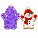 Royal Orchid Lavender Cute Snowgirl with Poinsettia Cookie Cutter & Embosser Two-Piece Set displayed beside a decorated snowgirl sugar cookie wearing a red winter hat, poinsettia flower, scarf, and mittens on a white background.