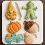 Finished fall decorations made with harvest silicone mold including pumpkin, acorn, scarecrow, gnome, truck and turkey