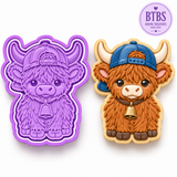 Purple Highland cow cookie cutter and embosser stamp featuring a cute cow wearing a backwards baseball cap with a decorated Highland cow sugar cookie.