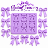 Elegant lavender ribbon bow decorations featuring satin-style loops and flowing tails, made as examples using an assorted bow silicone mold for cakes, cupcakes, and cookies.