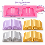 Pink open-book silicone mold with two book cavities displayed above four finished book-shaped decorations in lavender, gold, and silver.