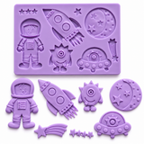 outer space silicone mold with astronaut, rocket ship, alien, moon, stars, shooting star and UFO designs