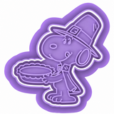 Close-up of Thanksgiving Pilgrim Beagle cookie cutter and matching embosser stamp featuring a pilgrim hat, floppy ears, festive clothing, and detailed Thanksgiving pie.